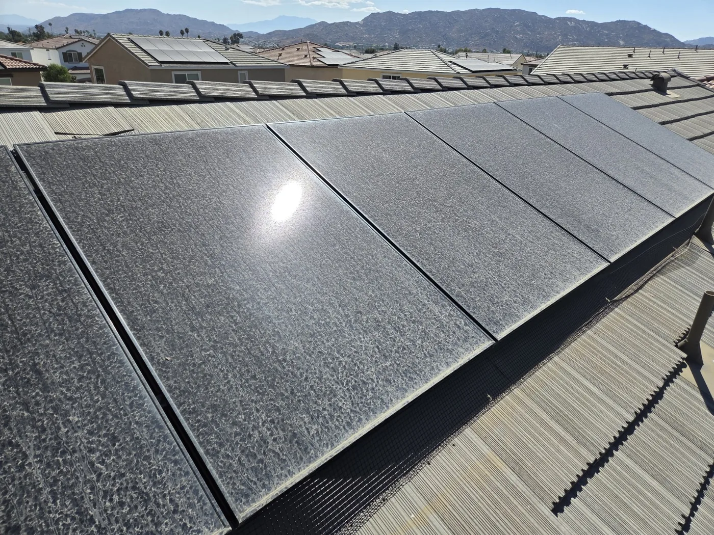 Solar panels heavily covered with dirt before cleaning