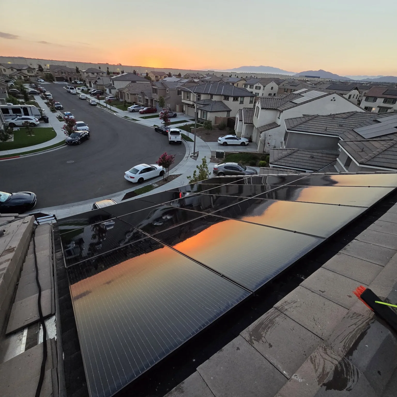 Sunset reflecting across freshly cleaned solar panels